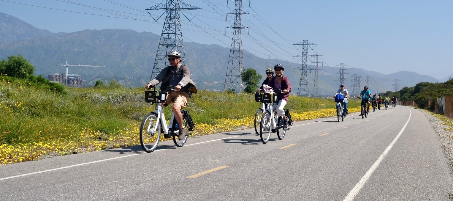 Group of people biking on a bike path