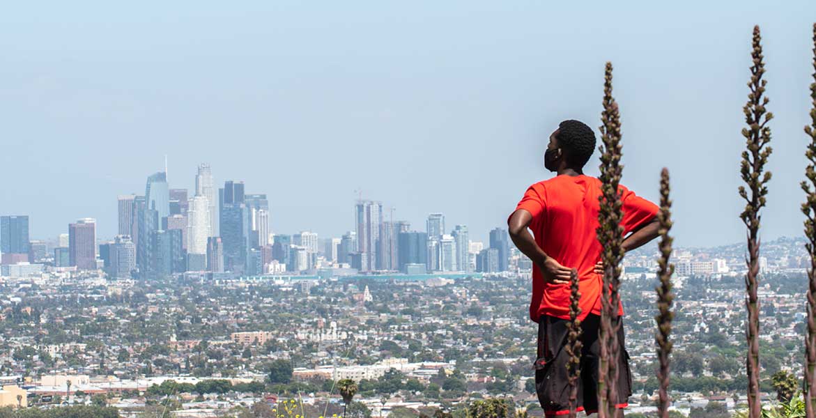 man overlooking downtown LA