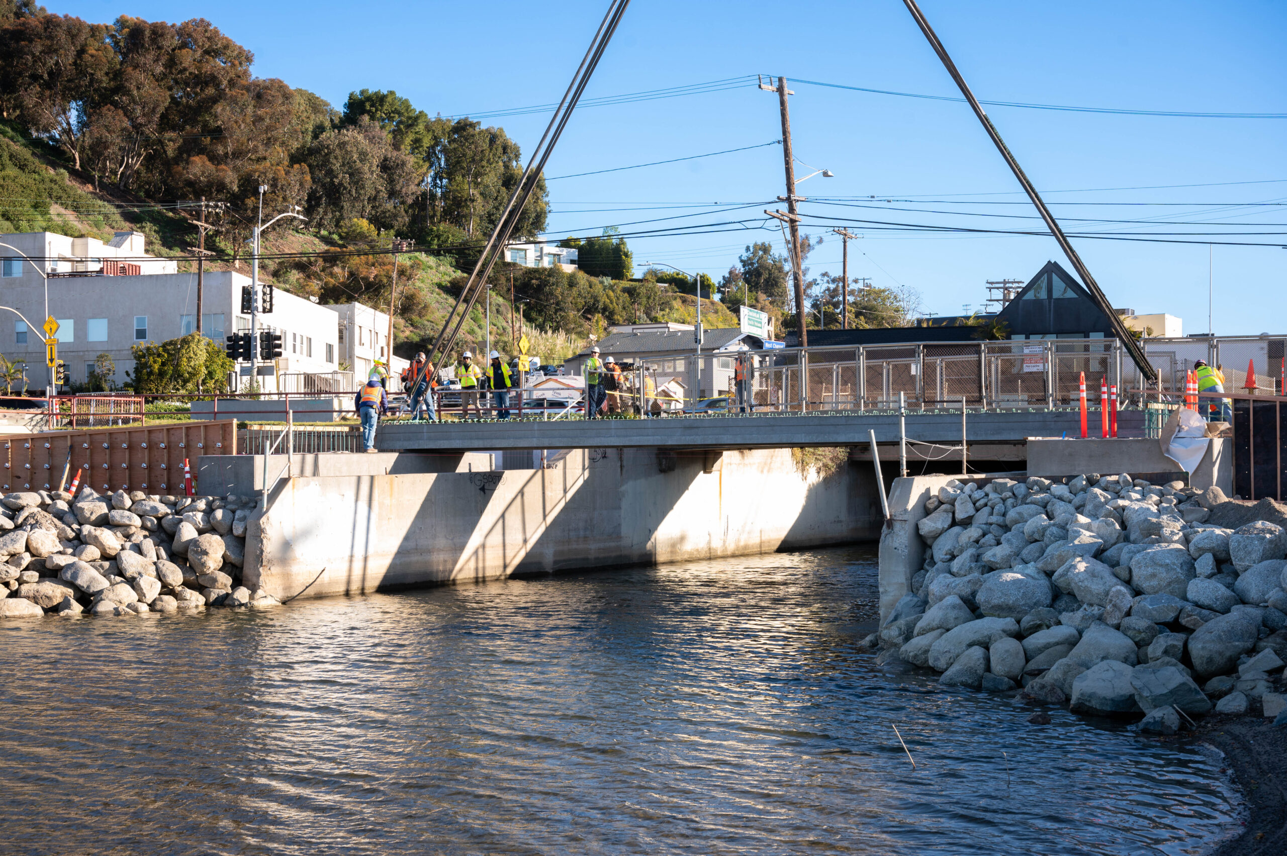Bridge over water with a group of engineers