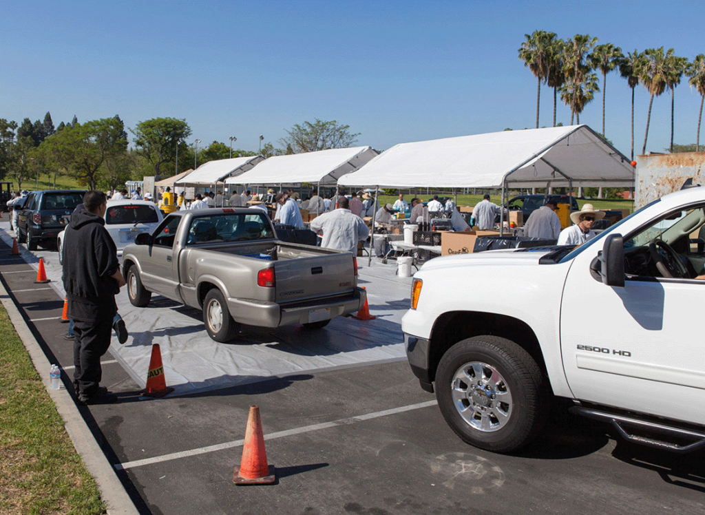 vehicles lined up for HHW/E-Waste collection event